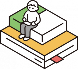 本の上に人が座っている